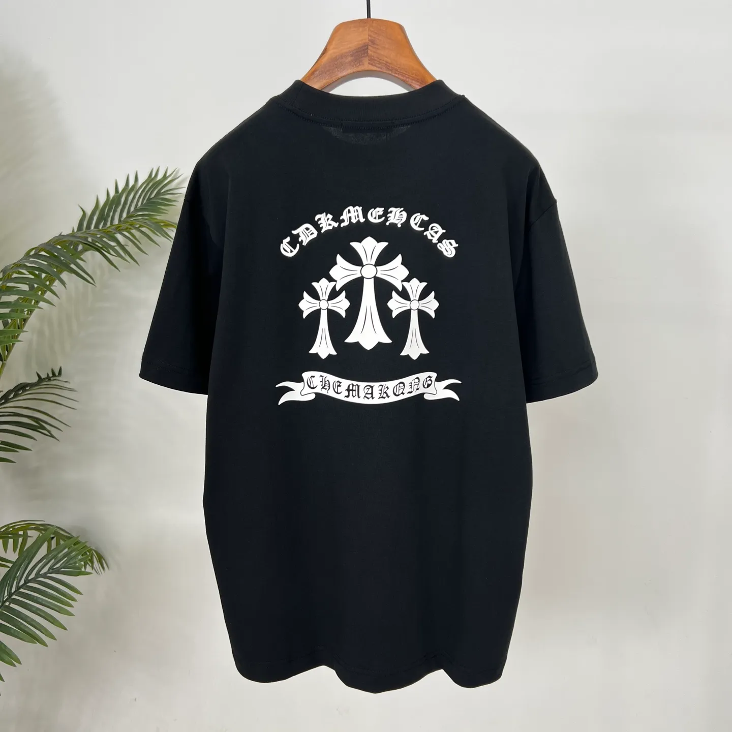 🅿️190 Crow Heart’s new summer T-shirt! This Sanskrit cross printed round neck short sleeves is simply a must-have for fashionistas. Salona cotton fabric is super comfortable, soft and skin-friendly, and has excellent breathability, making it perfect for summer wear. The Sanskrit cross print design on it is amazing, full of mystery and high-end, and the details are so exquisite that it makes people scream. It is worthy of Kroxin, and it vividly interprets the trend and personality. The loose fit is super friendly to all body shapes, covers the flesh and is comfortable, and looks good no matter how you wear it. Pair it with jeans and you'll look cool on the street. Pair it with sweatpants and you'll instantly look energetic and trendy. When you wear it and go out, you will feel like you are the spokesperson of fashion, and it will definitely turn heads. Color: black, white Size: S-2XL